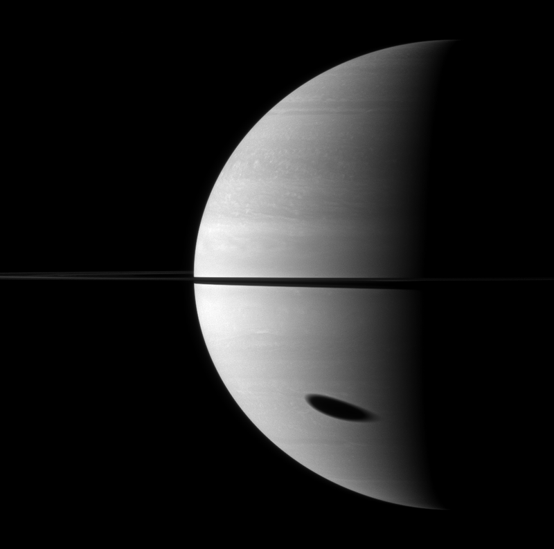 Titan’s shadow on Saturn, as seen by Cassini in 2009. Image: NASA/JPL/Space Science Institute